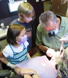 Dr. Craven enjoys time with curious kids while working on their mother