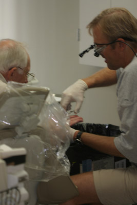 Dr. William J. Schlotz, DDS, Plaza Health Dentistry, performing Dental Treatment
